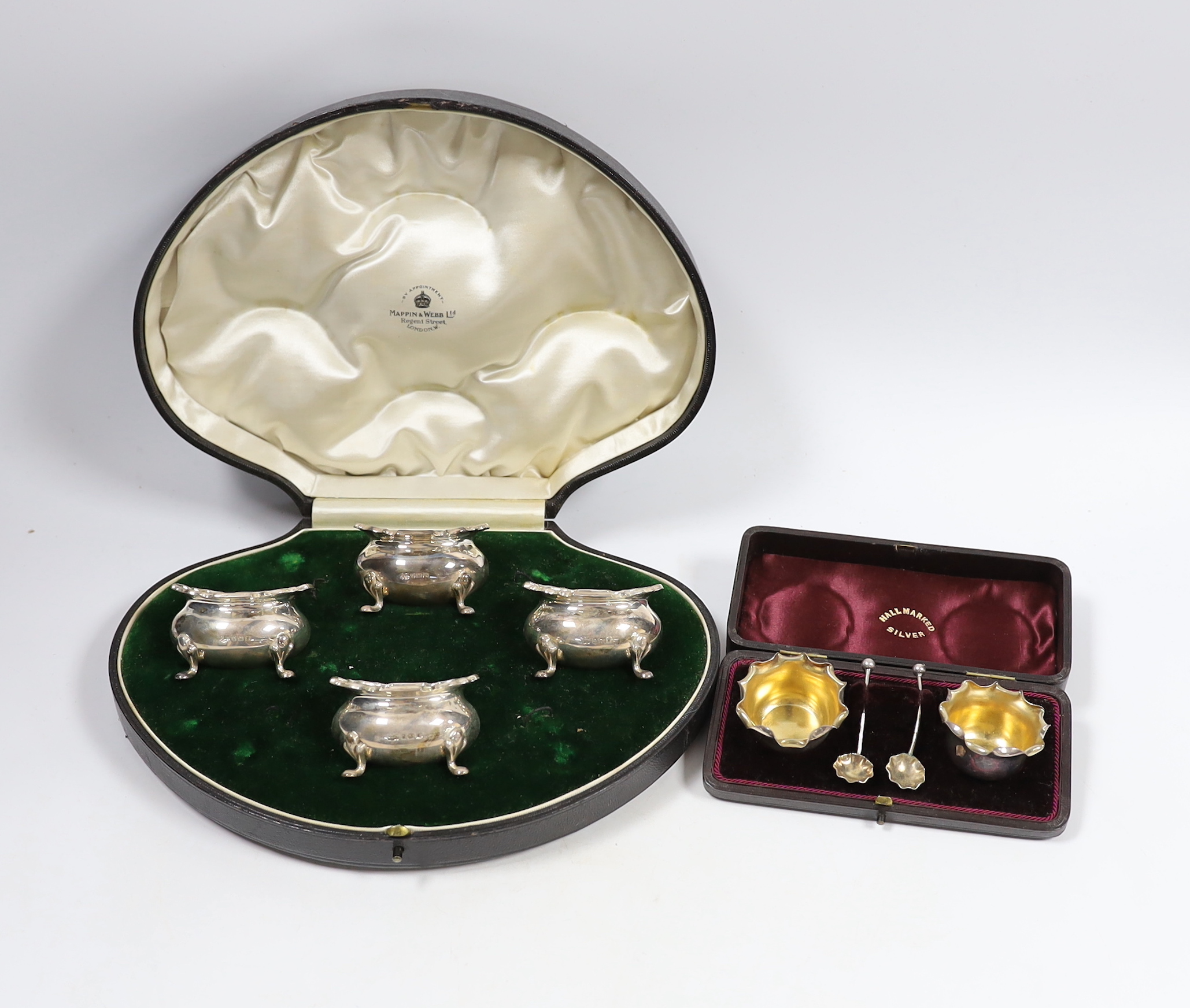 A cased set of four George V silver salts by Mappin & Webb, Birmingham, 1915, no spoons, together with a cased pair of late Victorian silver salts with spoons, Deakin & Francis, Birmingham, 1892.